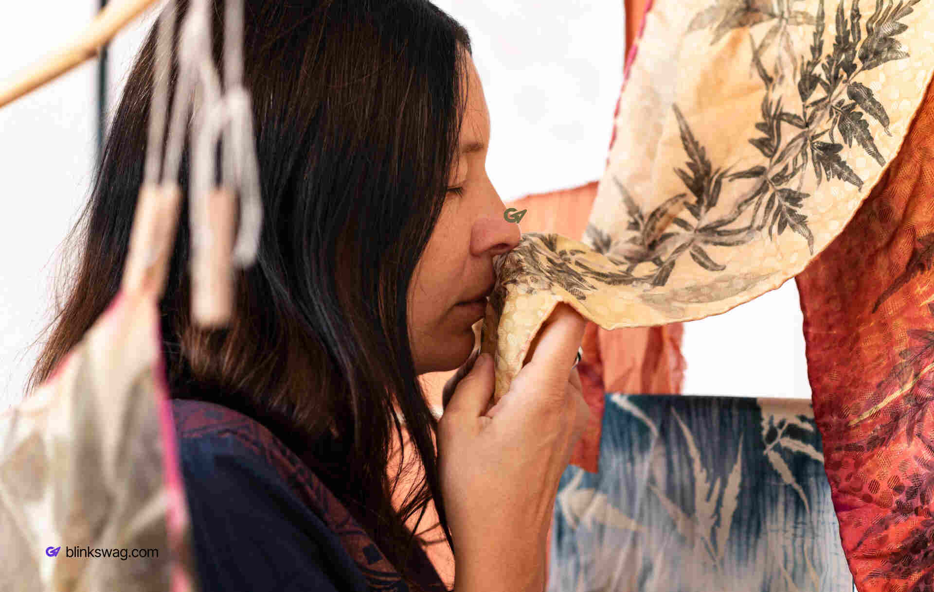 A lady is checking pigmented cloths