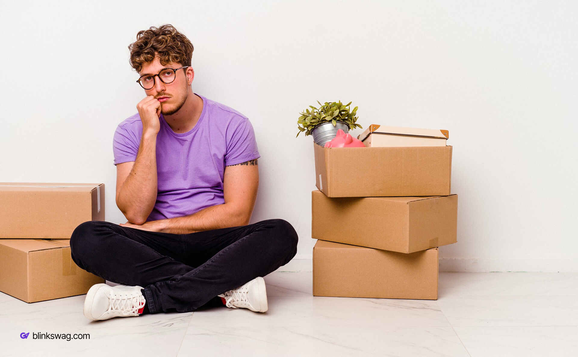 From Merch to Mission: Employee Engagement Platforms Craft Culture with Gifts 1 a person sitting on floor with some boxes