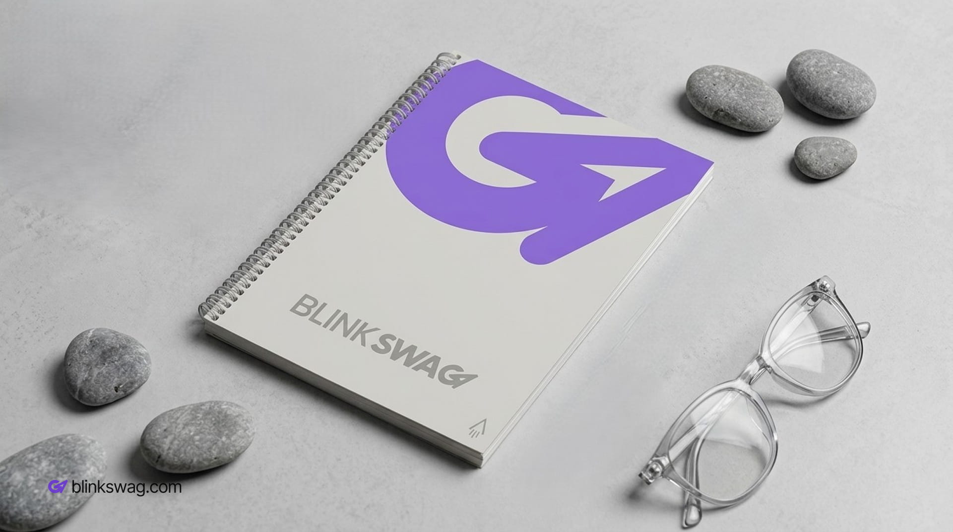 Branded Spiral custom corporate notebook and glasses.