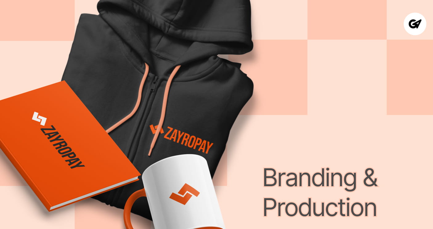 Custom branded merchandise set including a black hoodie, orange notebook, and mug with the Zayropay logo.